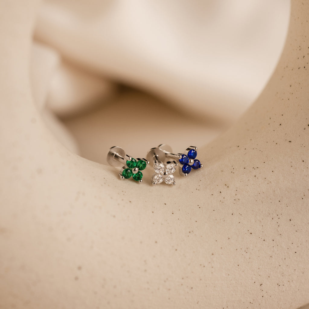 A close-up of the Flower Flat Back Studs Set highlights their delicate floral design and comfortable flat back style.