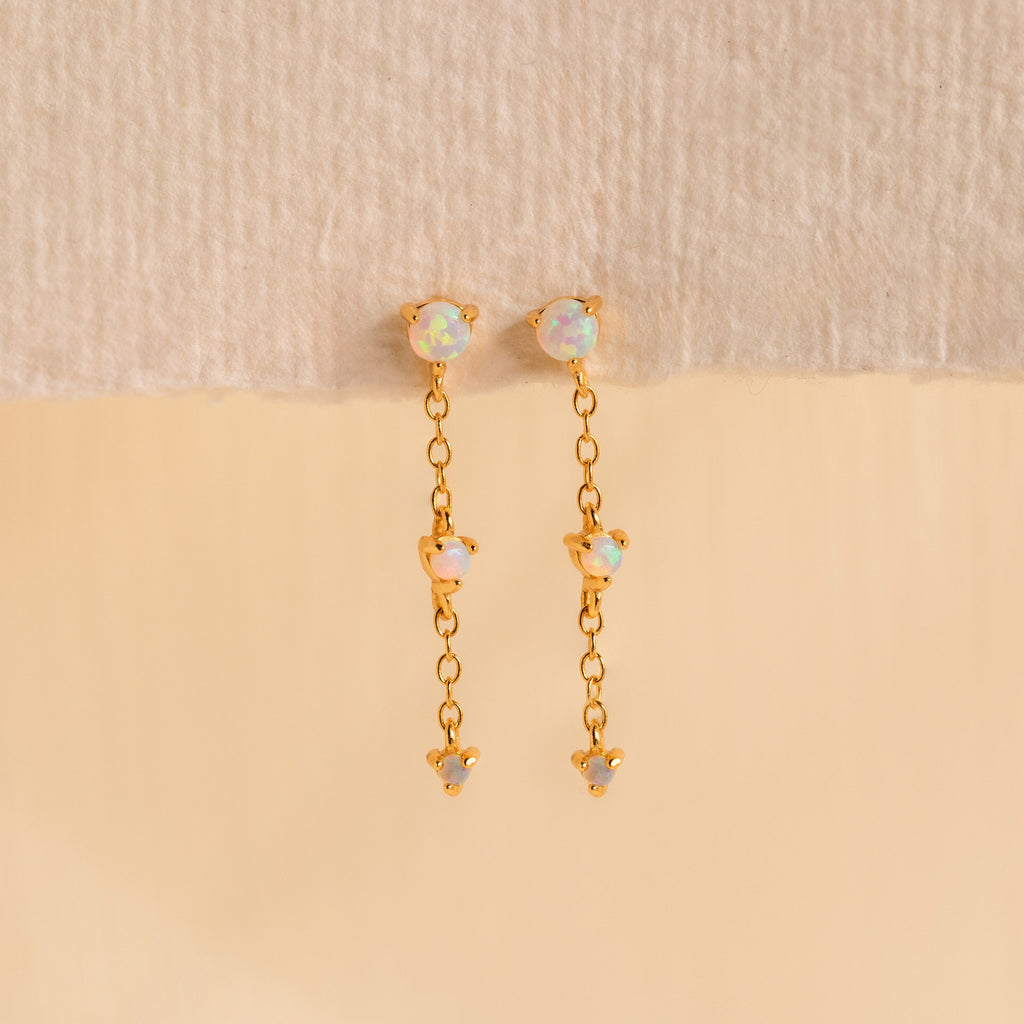 Dainty Opal Stud Earrings Set displayed against a neutral beige background—ideal for fans of minimalist jewelry and elegant opal stud earrings.