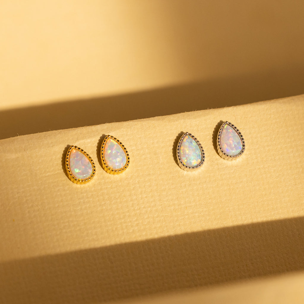 Opal Teardrop Studs are earrings with white stones, perfect for adding vintage-inspired charm to your statement jewelry collection.