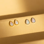 Opal Teardrop Studs are earrings with white stones, perfect for adding vintage-inspired charm to your statement jewelry collection.