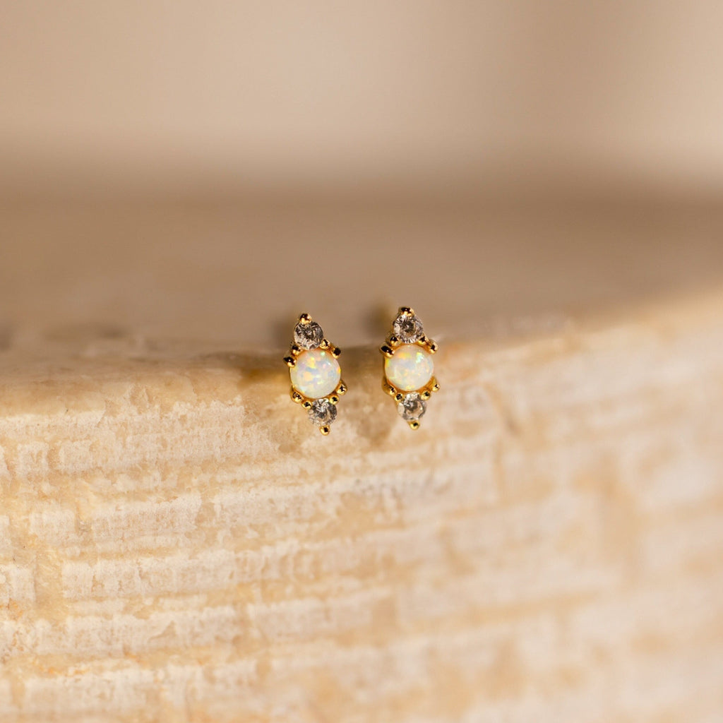 Opal and Diamond Studs: elegant cartilage earrings with opal and diamond stones, perfect for helix piercings.