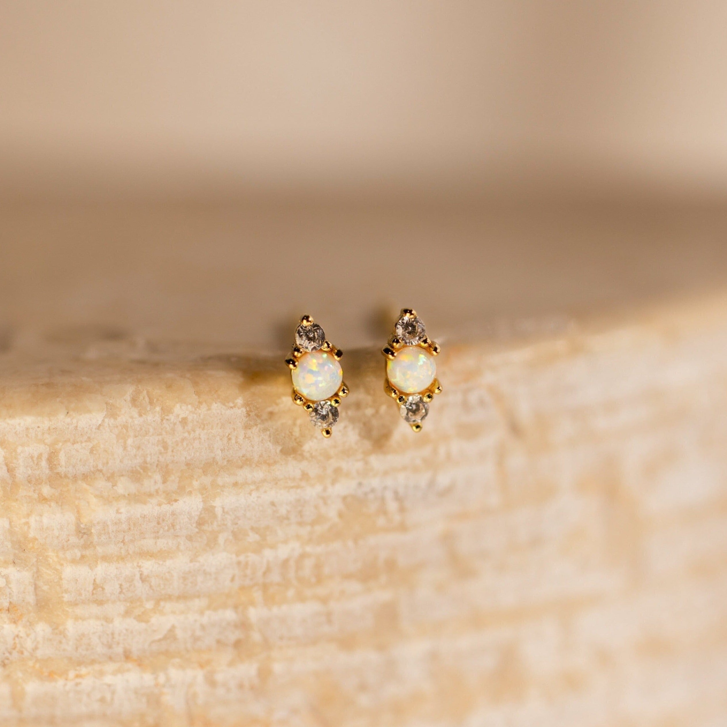 Opal and Diamond Studs: elegant cartilage earrings with opal and diamond stones, perfect for helix piercings.