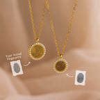 Two Pave Fingerprint Coin Necklaces with custom engraved fingerprint designs are displayed beside matching fingerprint images on a soft beige background—a meaningful memorial gift.