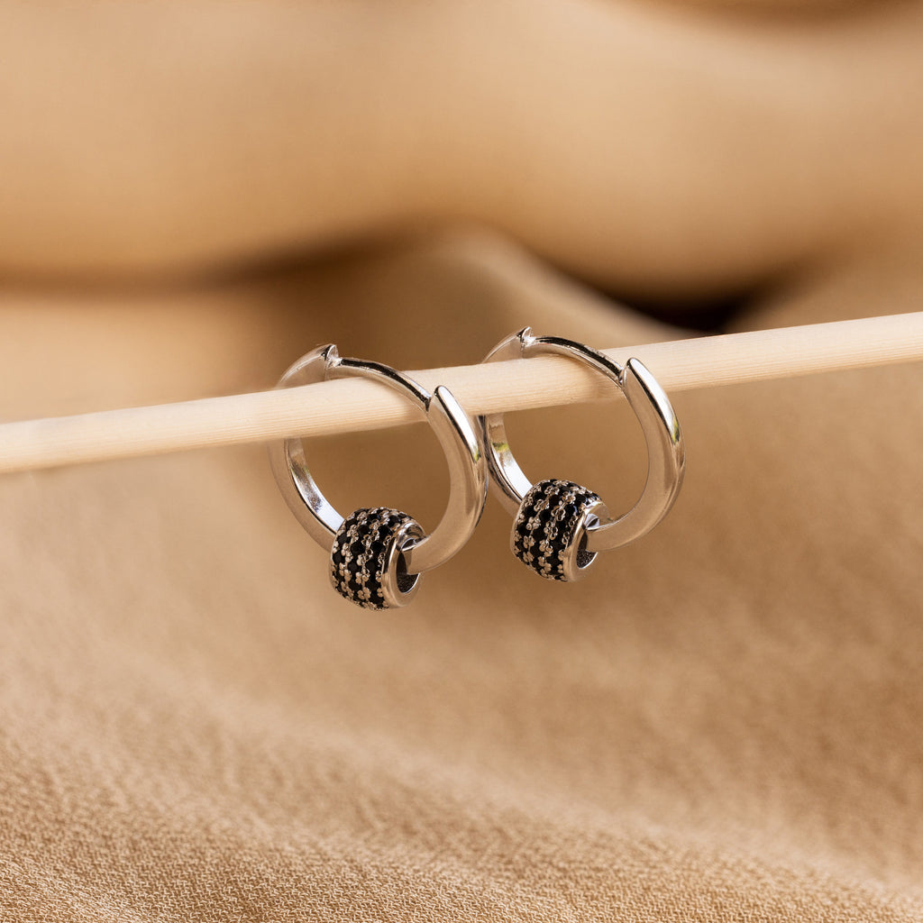Onyx Pave Beaded Hoops are elegant huggie-style earrings, featuring sparkling black onyx pavé detailing.