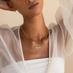 A woman wearing the Luna Name Necklace in Paperclip Chain adds a modern flair to her look.