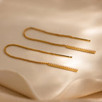 The Pearl Bar Threader Earrings pair beautifully with a gold diamond chain, creating a sophisticated, modern pearl jewelry look.