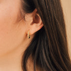 A close-up of a woman's ear showcases the bold appeal of the Summer Statement Earrings Set, featuring chunky hoops perfect for making a statement this season.