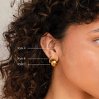 A close-up of a woman's ear adorned with the Summer Statement Earrings Set.