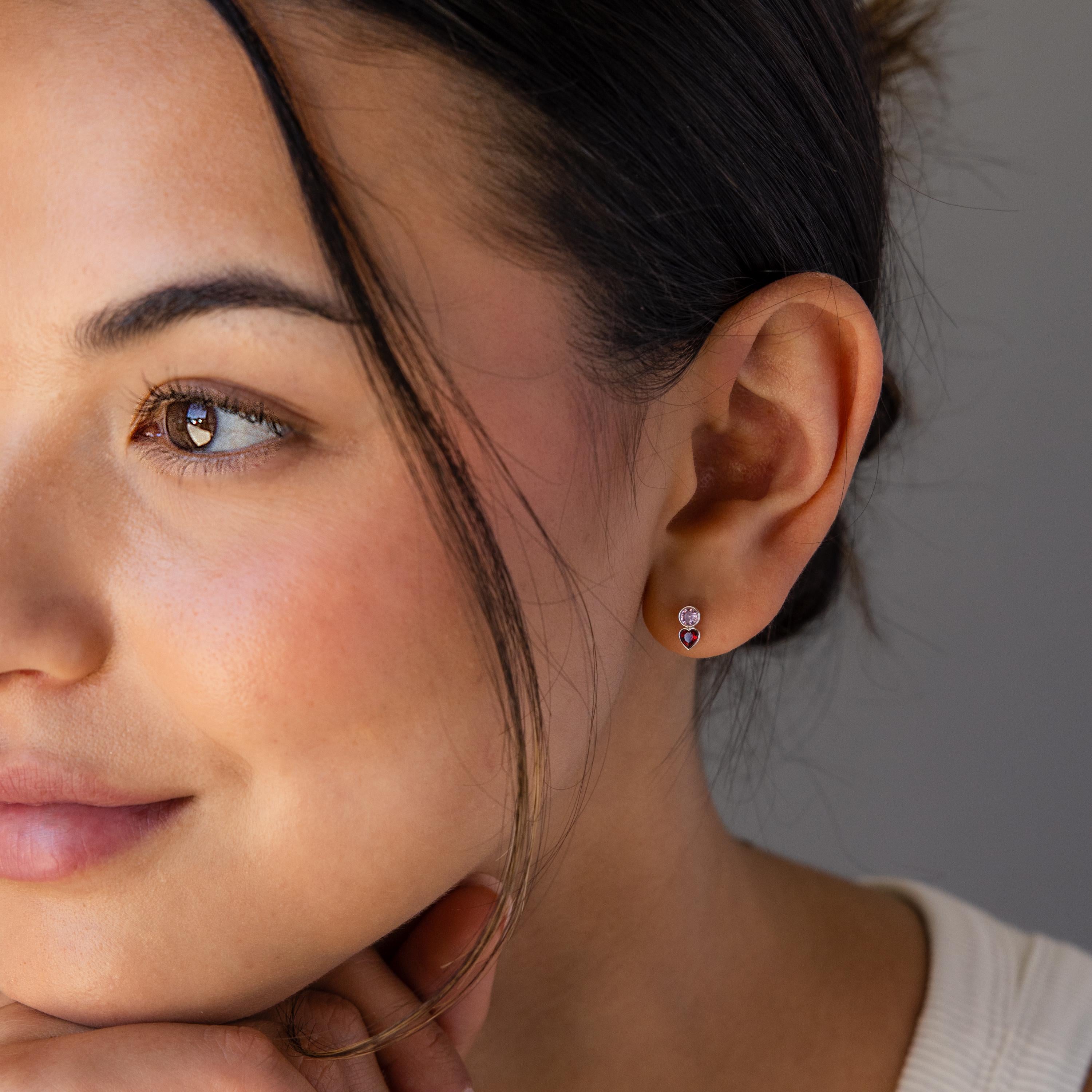 Woman with glowing skin and brown eyes wears Toi et Moi Birthstone Studs—personalized teardrop earrings that make a perfect custom gift, her soft smile radiating joy.