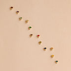 The Diamond Marquise Birthstone Studs feature a row of sparkling gemstones in an elegant marquise-cut design, perfect for adding shine to any outfit.