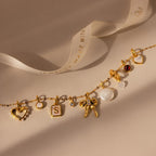 Classic Pearl Heart Charm in 18K Gold, heart pendant, and alphabet initials are beautifully displayed on a neutral background.