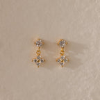 Ivy Flower Flat Back Studs feature small, clear gemstones in a floral design on a textured beige surface—an ideal, thoughtful Mother’s Day gift.