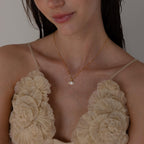 Model wears mirror chain with Pave Evil Eye Charm