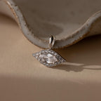 Silver Pave Evil Eye Charm. The design features a marquise diamond in the center with pave gemstones surrounding it in the shape of an eye.