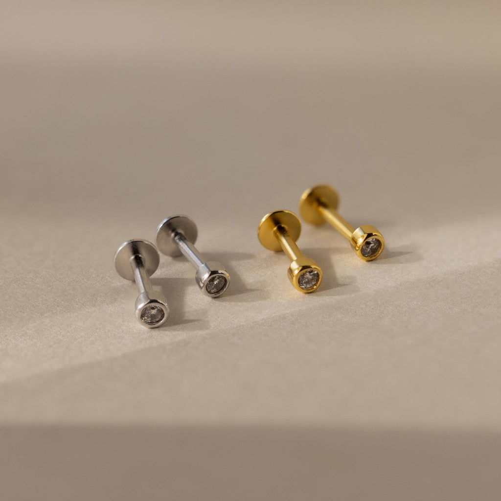 The Small Diamond Bezel Flatback Studs are elegant diamond earrings, perfect for adding a subtle touch of sparkle to any look.
