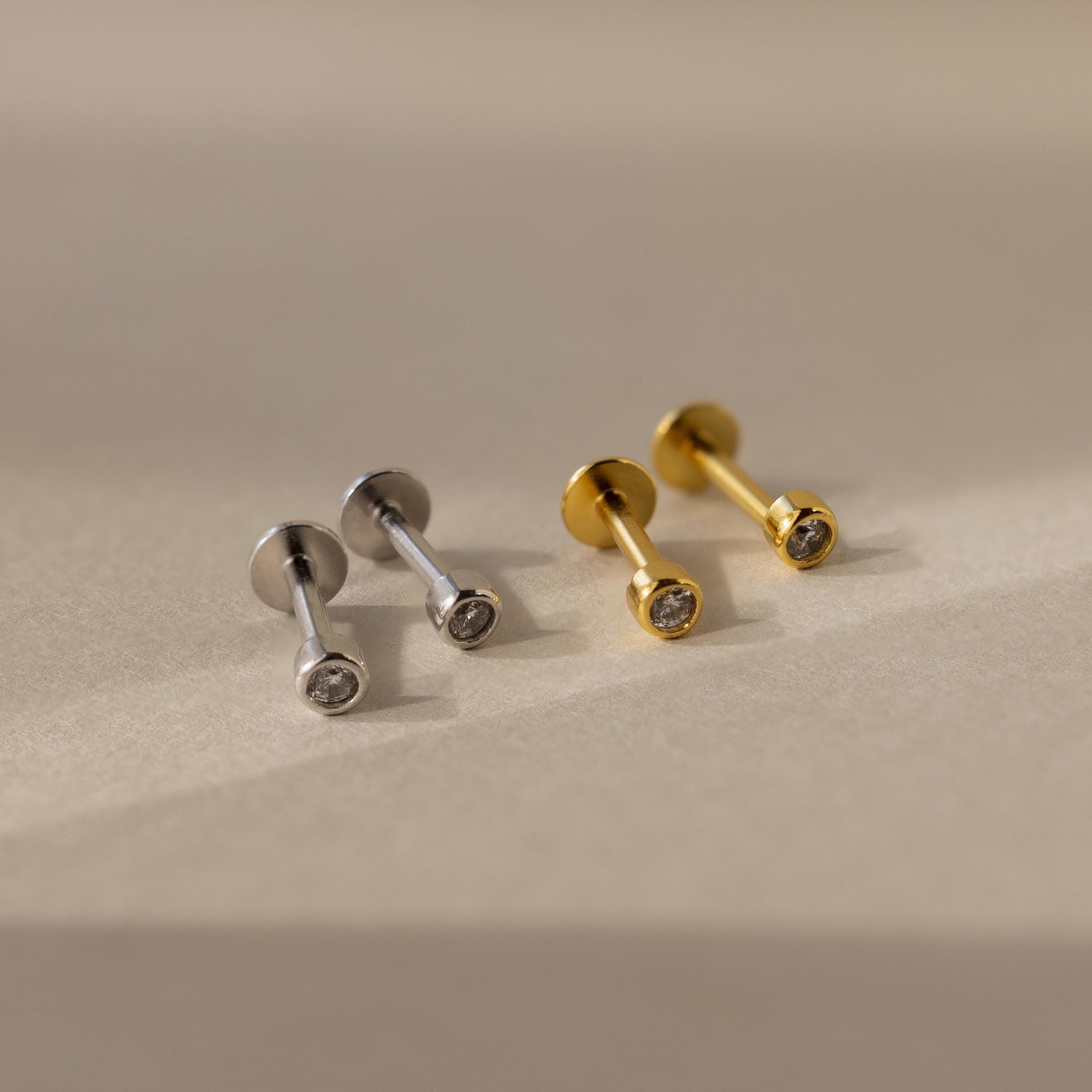The Small Diamond Bezel Flatback Studs are elegant diamond earrings, perfect for adding a subtle touch of sparkle to any look.