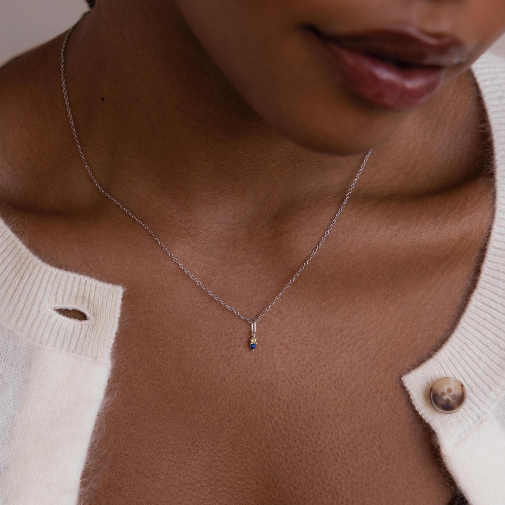 Model wearing silver cable chain with Dainty Duo Birthstone Charm