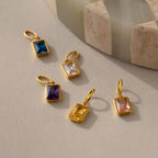 Multiple emerald birthstone charms in different stone colors including Amethyst, Blue Zircon, Diamond, Topaz and Pink Tourmaline