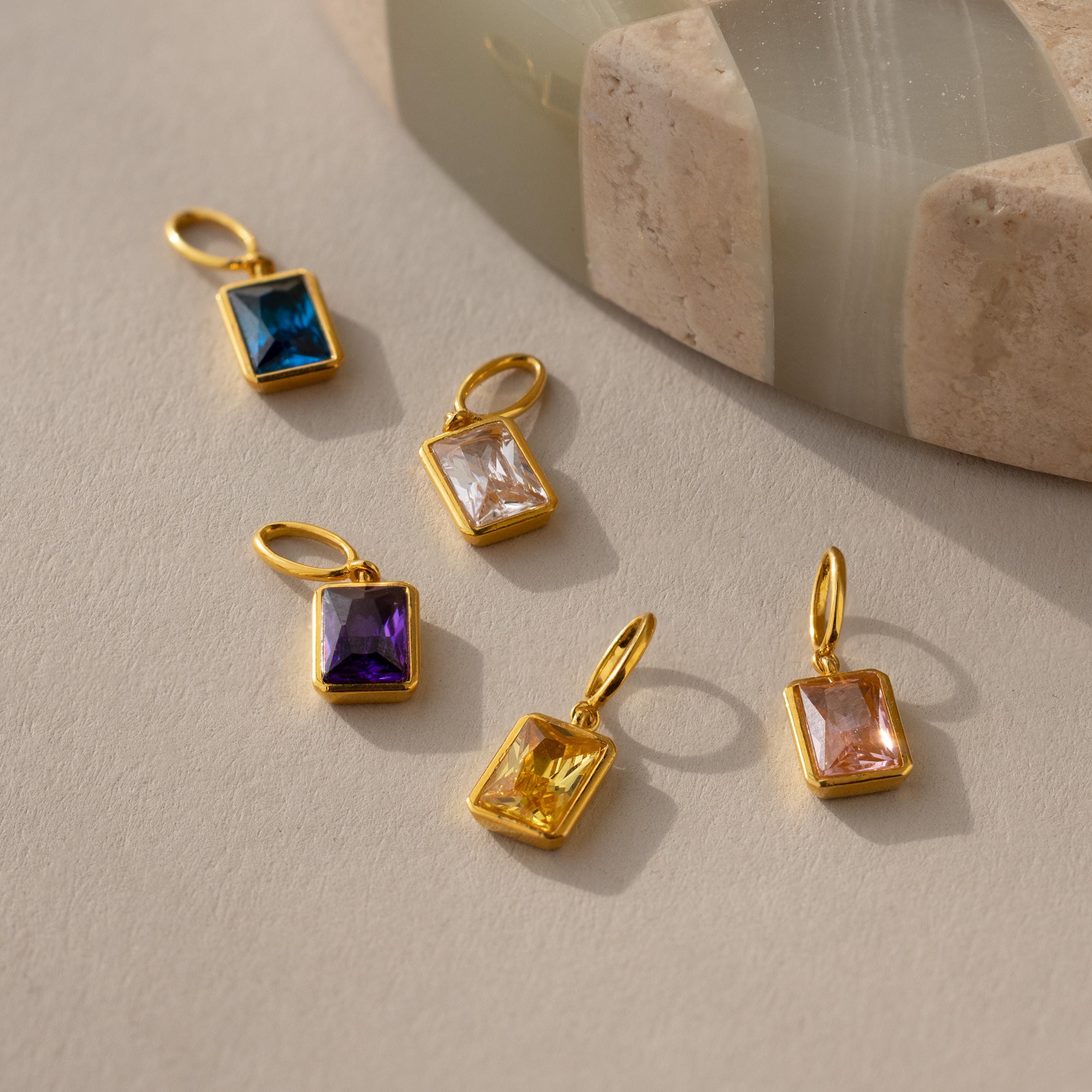 Multiple emerald birthstone charms in different stone colors including Amethyst, Blue Zircon, Diamond, Topaz and Pink Tourmaline