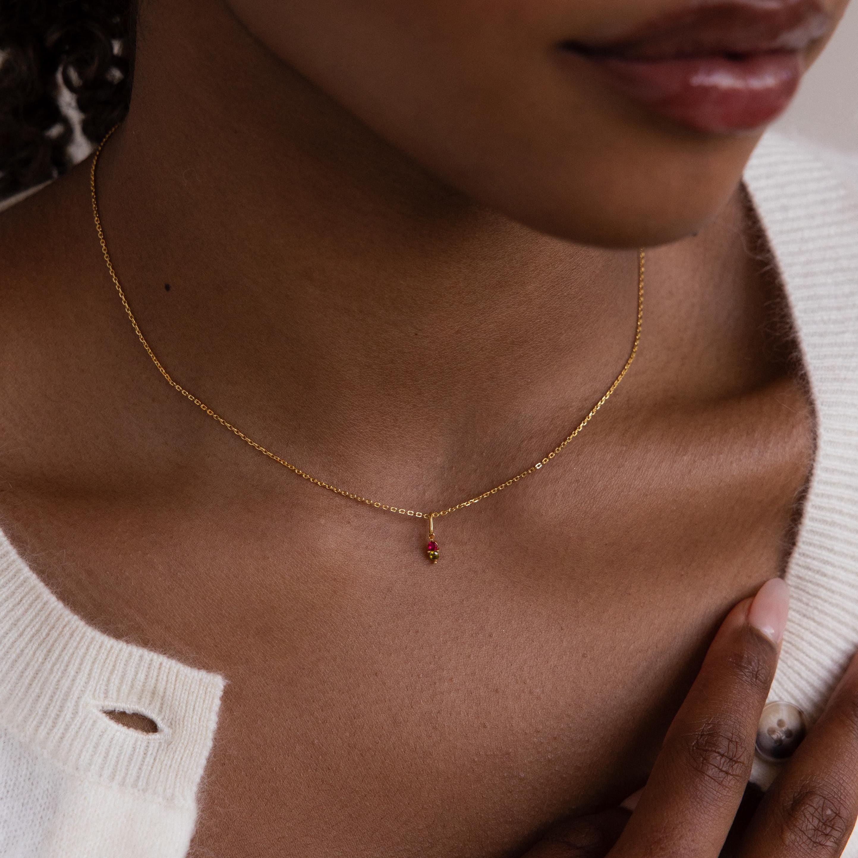 Model wears a gold Dainty Duo Birthstone Charm on a cable chain necklace