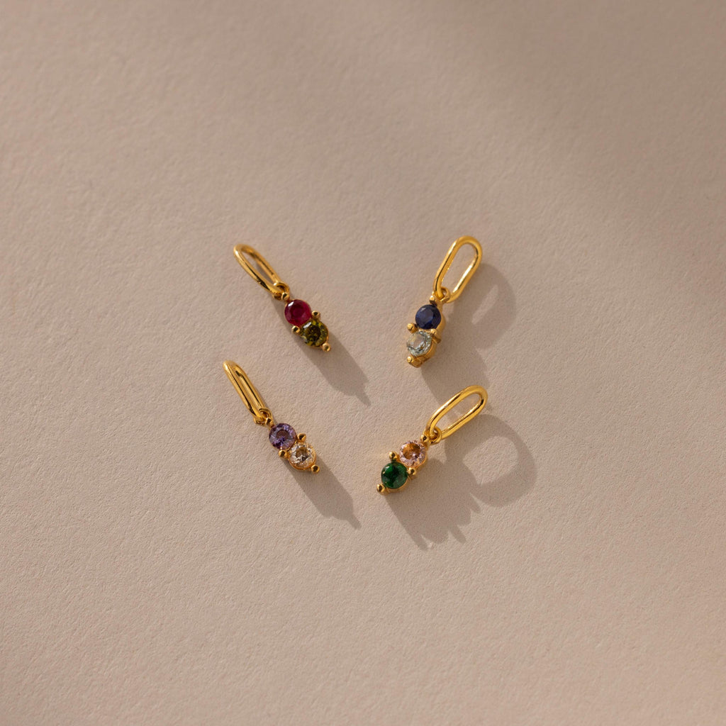Four gold dainty Duo Birthstone Charm with different birthstone colors 
