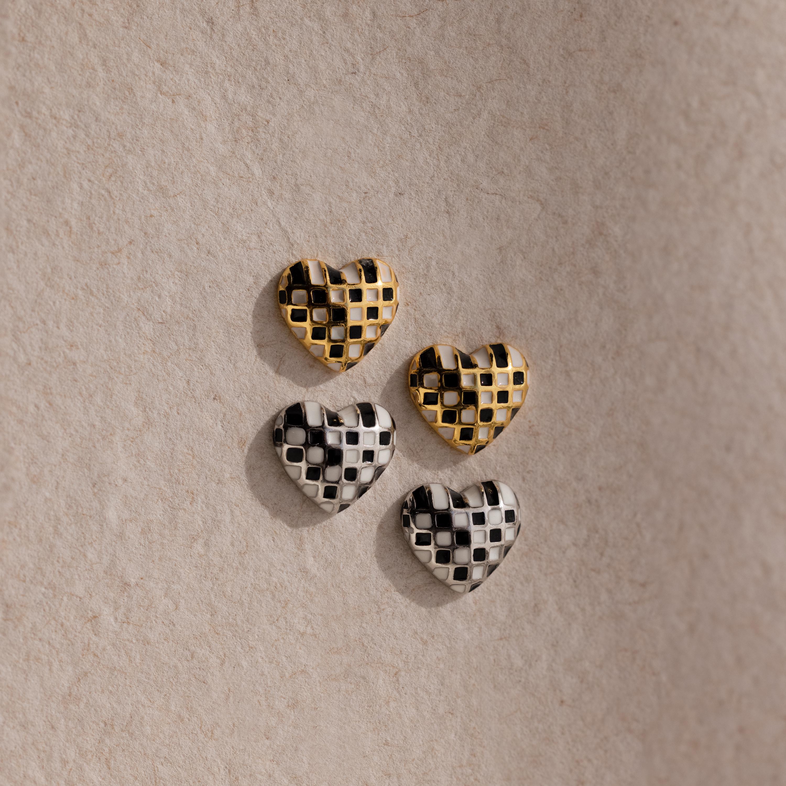A set of heart-shaped buttons, inspired by the Checkered Heart Studs, brings retro charm to any project.