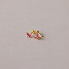 The Butterfly Birthstone Flatback Studs are personalized gold earrings that add a unique touch to any look.