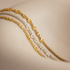 The Diamond Tennis Letter Bracelet features sparkling diamond letter charms—choose from options like MAMA, CELESTE, or CLARA—for a chic and stylish accessory perfect for any occasion.