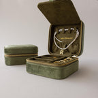 Velvet Mirror Jewelry Box set—one open to display a necklace, rings, and earrings, the other closed. Ideal as a travel case or stylish display piece for your favorite jewelry.