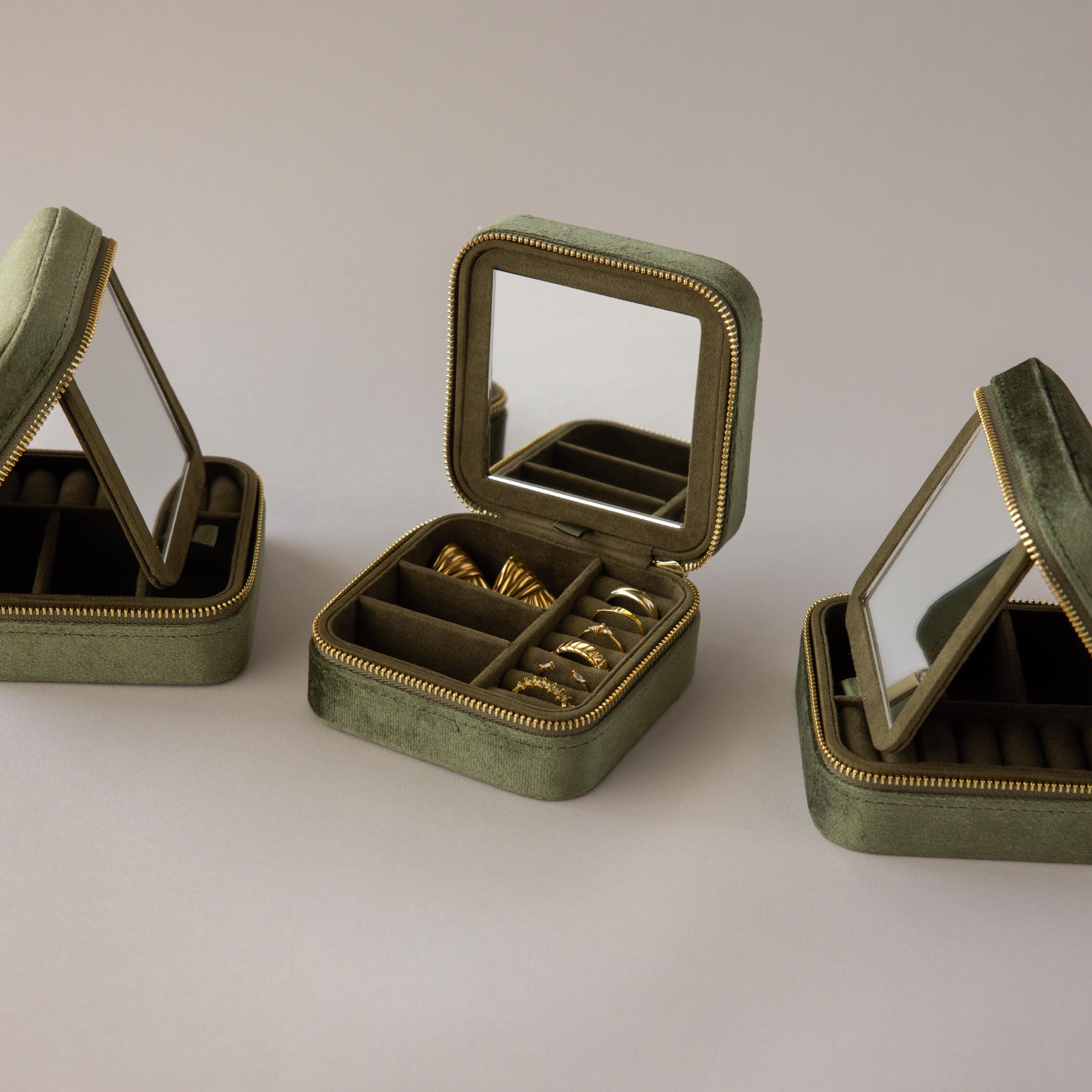 Three Velvet Mirror Jewelry Boxes, all green, shown with one open to display gold rings. Each box features a mirror inside the lid.