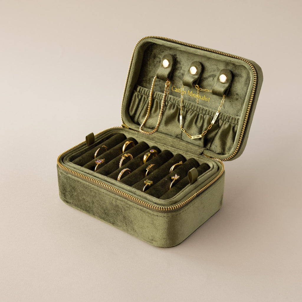 The Rectangle Velvet Jewelry Box, made from olive green velvet in a sleek rectangular design, is perfect for displaying gold rings, bracelets, and necklaces.