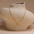 The Diamond Tennis Clasp Necklace is displayed on a textured, abstract bust against a neutral background—an elegant pick for wedding jewelry.