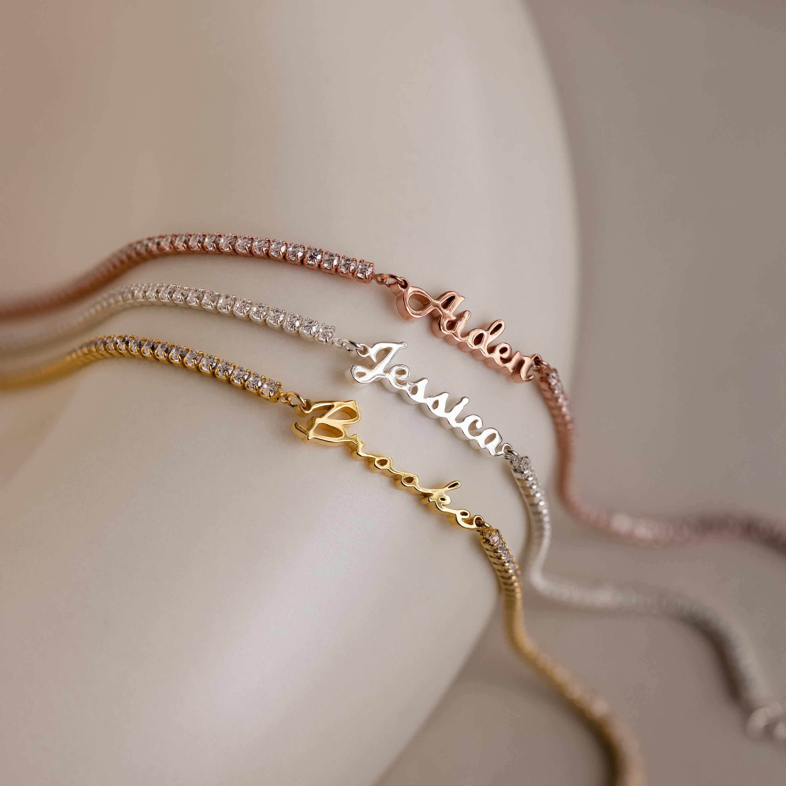 Three Venice Name Tennis Bracelets personalized with the names Aspen, Jessica, and Brooke in gold, silver, and rose gold—each offering a touch of timeless elegance.