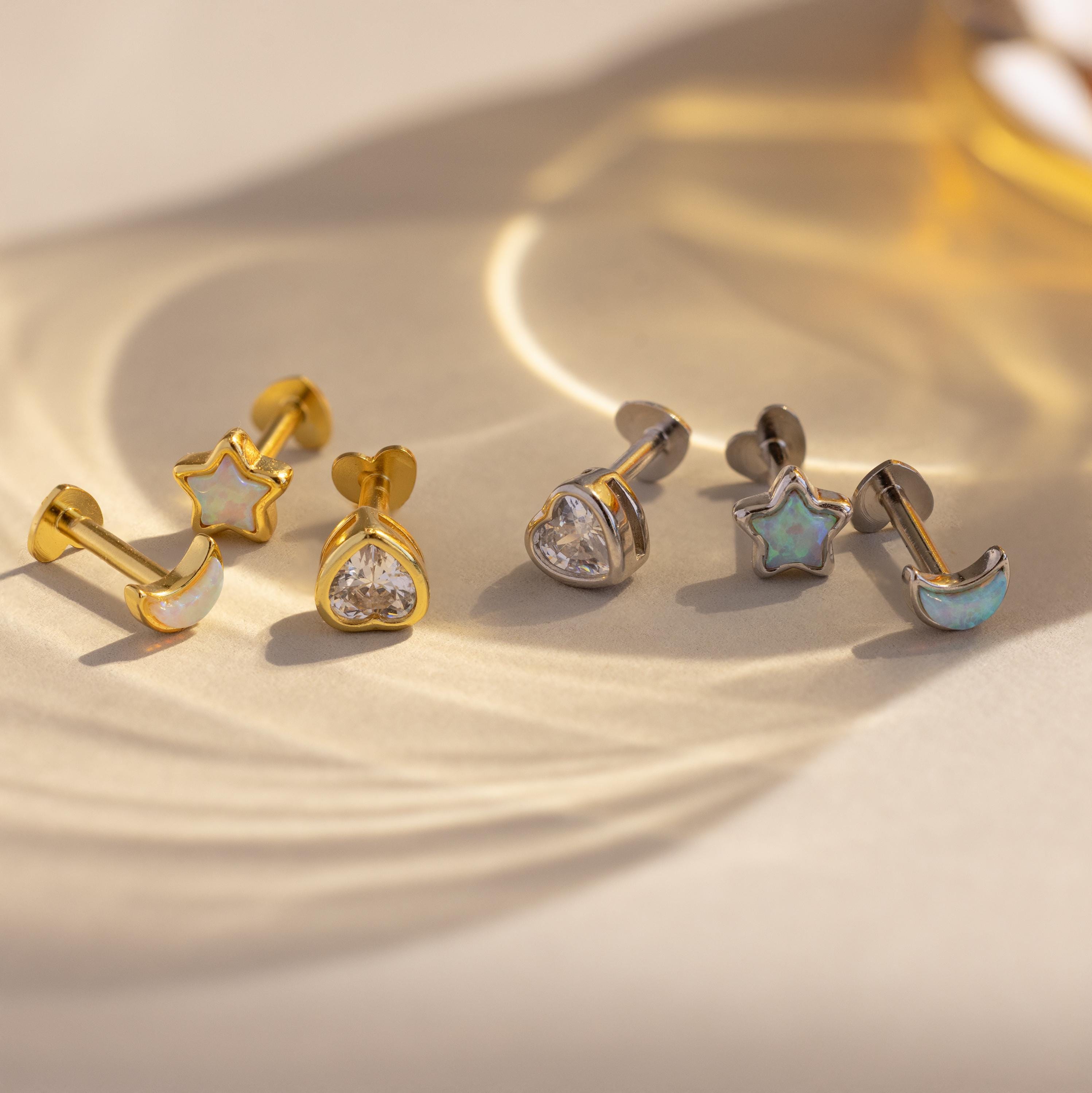 Close up of Gold and Silver Opal and Diamond Celestial Stud Earring 3 Piece Sets with heart shaped flat backings