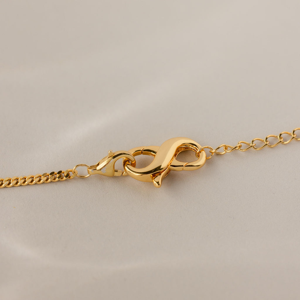 Close-up of the Multipurpose Lobster Clasp Extender Set in 18K Gold displayed on a neutral background.