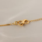 Close-up of the Multipurpose Lobster Clasp Extender Set in 18K Gold displayed on a neutral background.