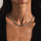 Close-up of a woman wearing a silver Foxtail Chain Necklace, styled the same as the gold version.