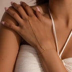 Model wearing the bracelet, hand resting on chest, with diamond details visible along the hand and wrist.