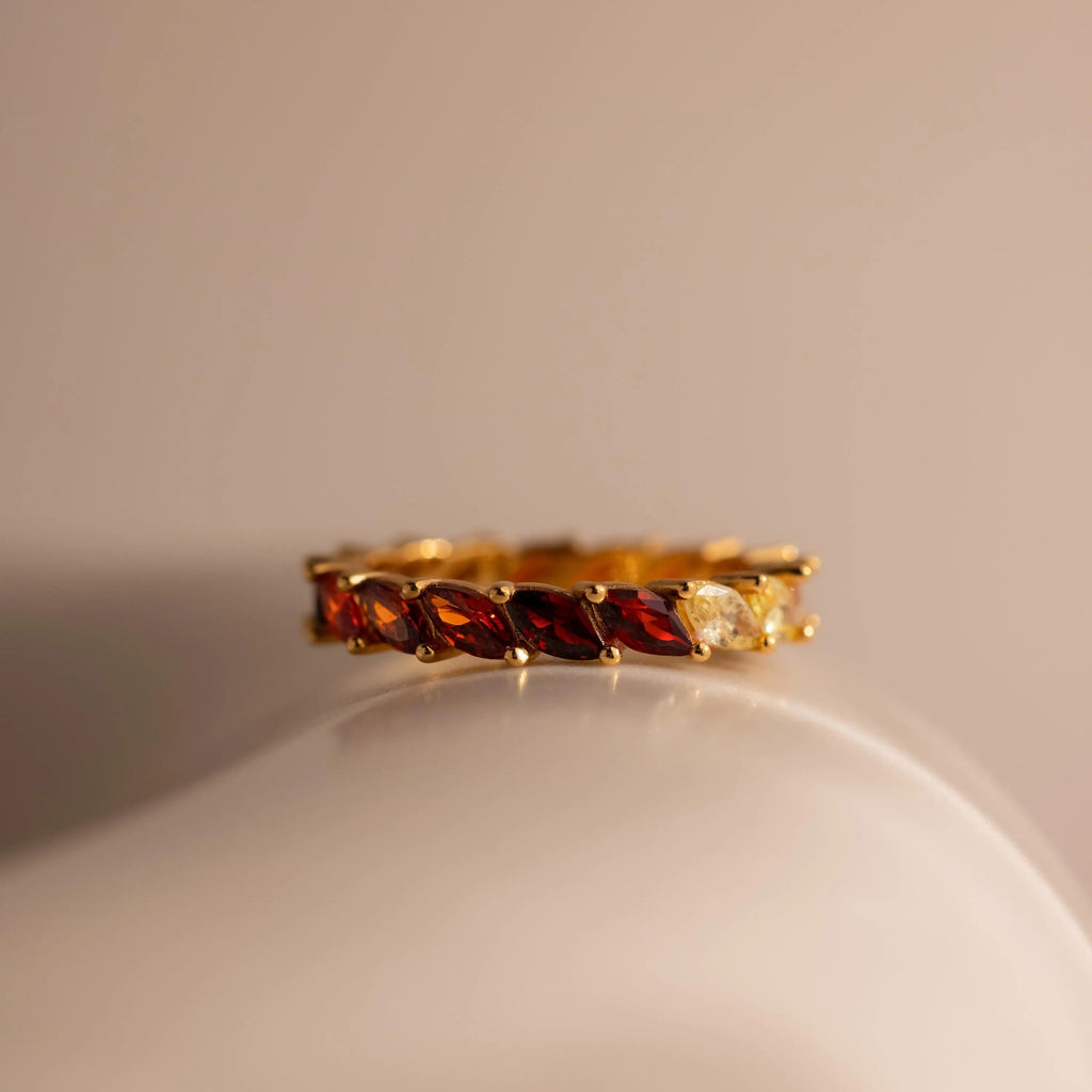 Close-up of a Red Marquise Ombre Ring with gradient marquise-cut stones in gold setting.