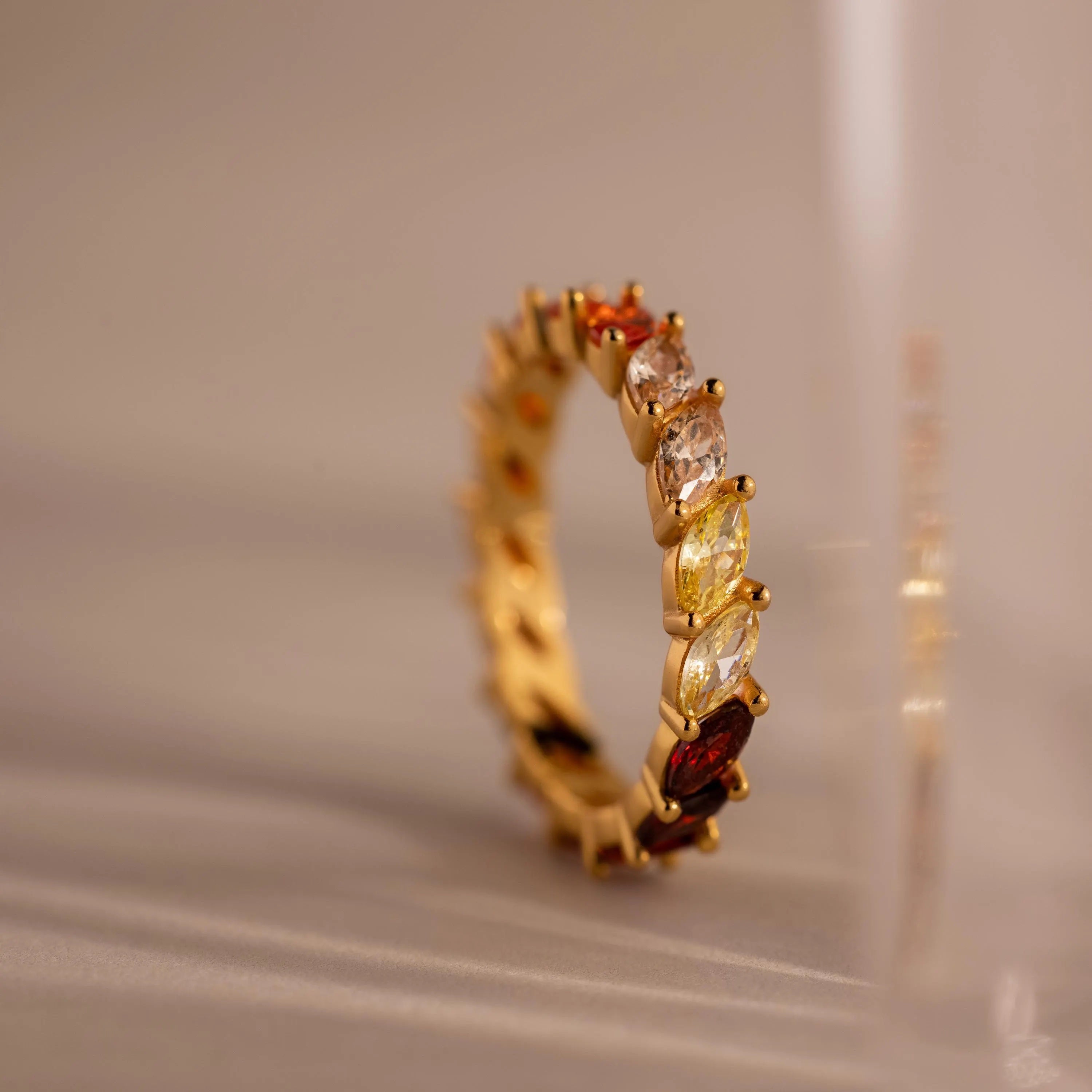 Close-up of Red Marquise Ombre Ring with gradient marquise-cut stones in gold setting.