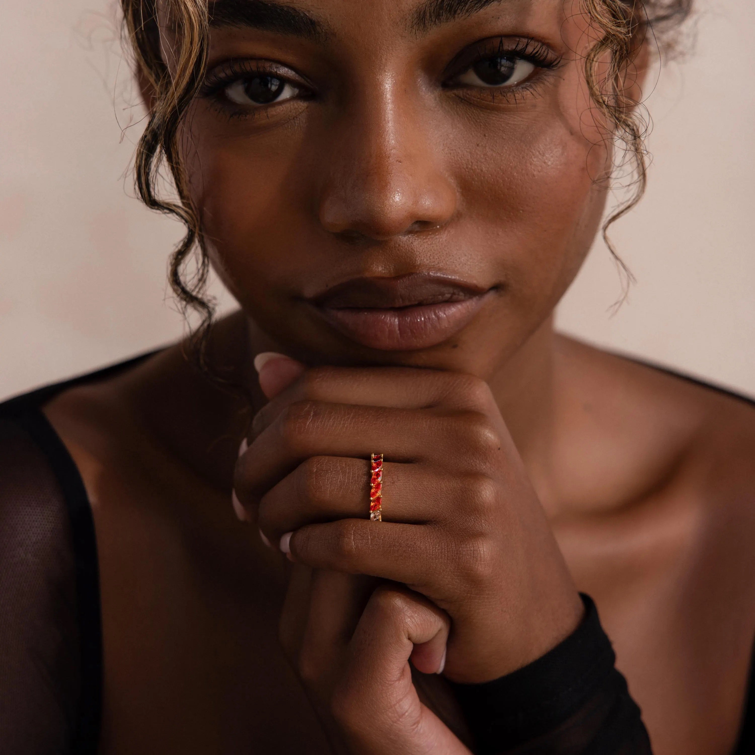 Model wearing a Red Marquise Ombre Ring with gradient marquise-cut stones in gold setting.