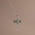 Silver chain necklace with a jade cross pendant, featuring polished silver end caps and an X-shaped detail at the center.