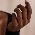Model wearing a Red Marquise Ombre Ring with gradient marquise-cut stones in gold setting.