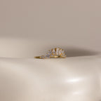 The Diamond Curve Cluster Ring is shown on a smooth, off-white surface with a neutral background.