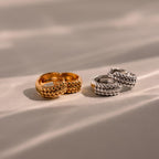 The Beaded Chunky Hoops set features gold and silver textured hoop earrings, blending classic style with a modern twist, beautifully displayed on a neutral surface with soft shadows.