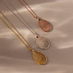The Fingerprint Birthstone Teardrop Necklace, available in gold, silver, and rose gold, features delicate gemstone accents—personalized jewelry that uniquely captures your story.