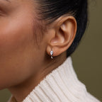 Close up of model wearing our Hammered Diamond Teardrop Hoops in Silver