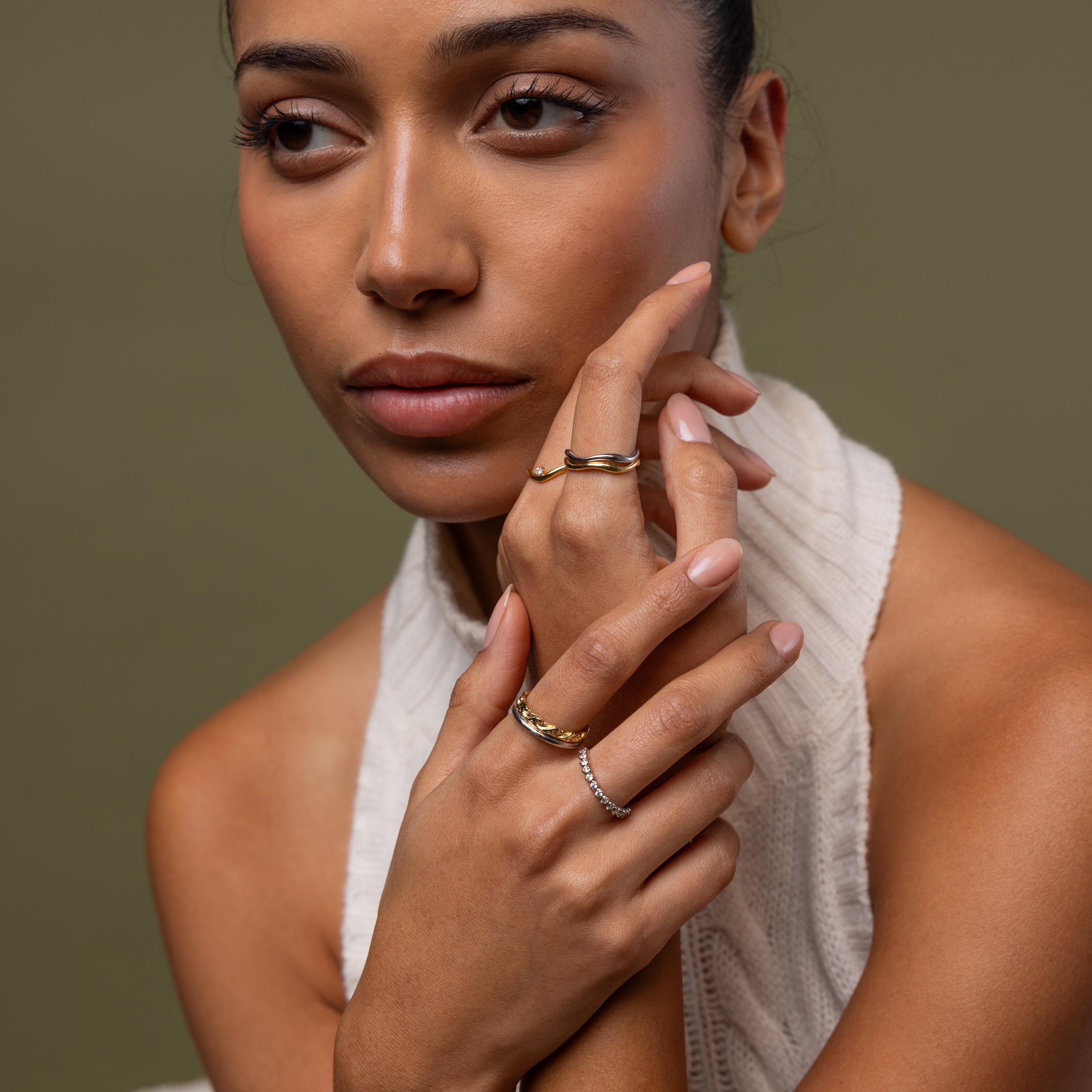 Model wearing our Diamond Wave Band, styled with our Duo Form Rings, Birthstone Curve Ring and Diamond Bezel Tennis Ring