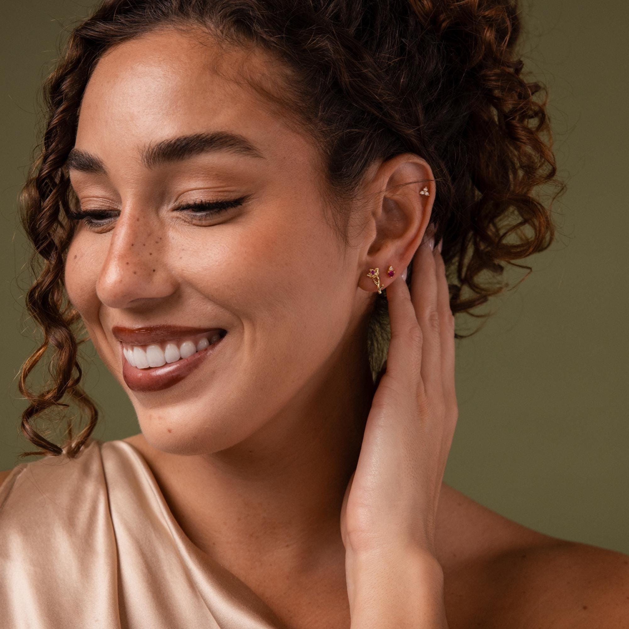 Model wearing our Birth Flower Stud Earrings, styled with our Opal cluster earrings and Birthstone Studs