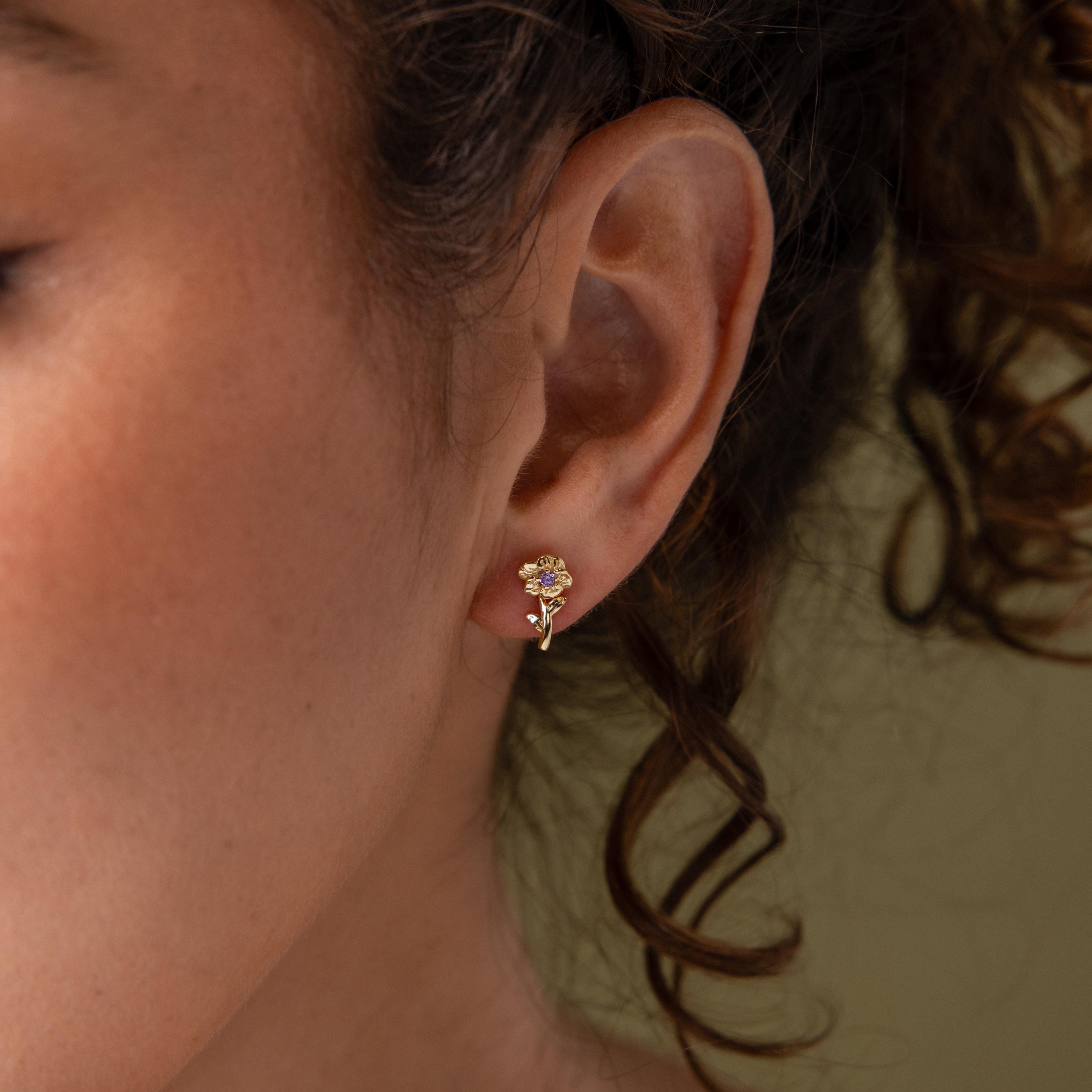 Close-up of a model wearing our Birth Flower Stud Earrings